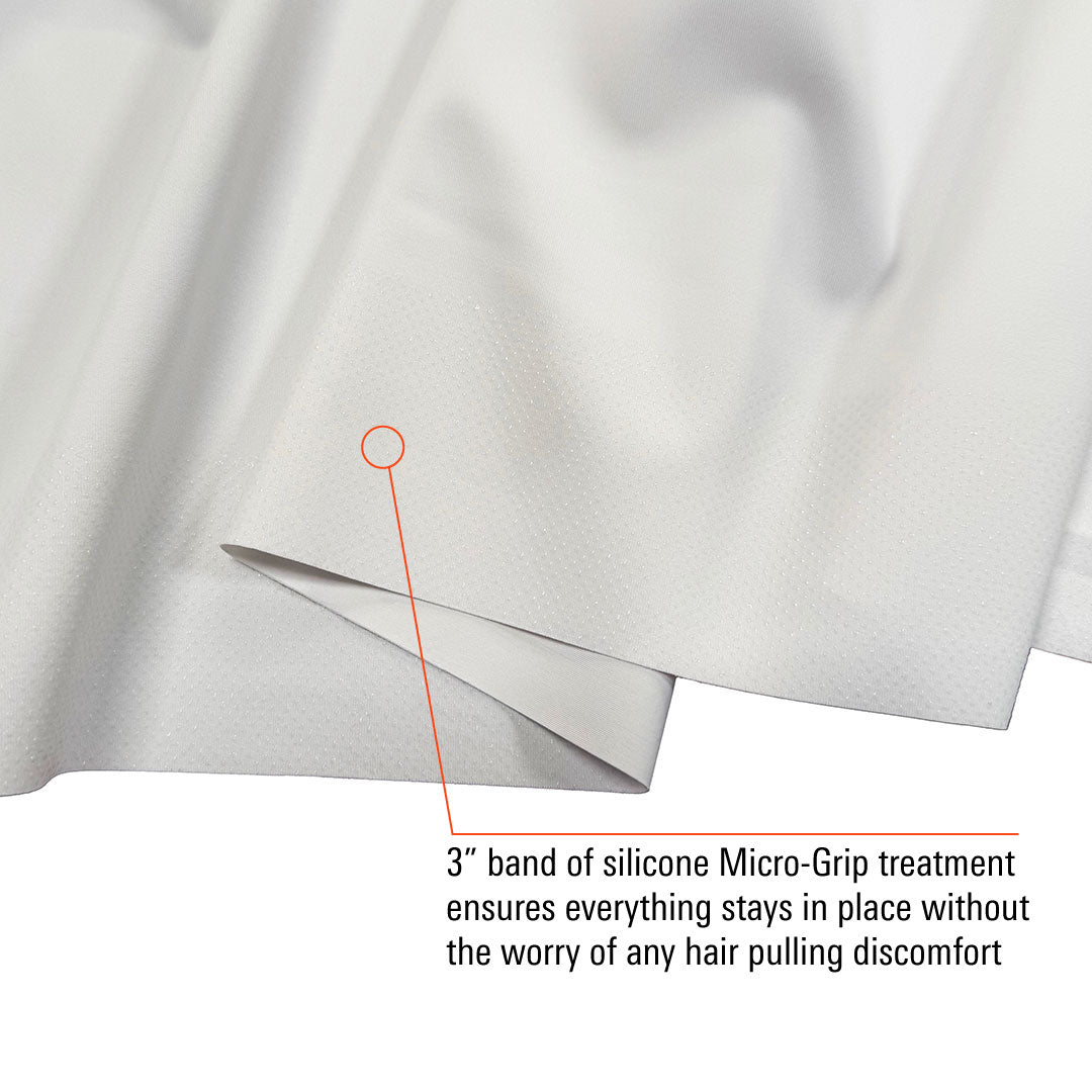Close-up of the white inner liner of the Men's 9" Titan Racer Half Tight - Jorts showing the 3-inch silicone Micro-Grip treatment band with dotted texture designed to keep the garment in place without pulling hair