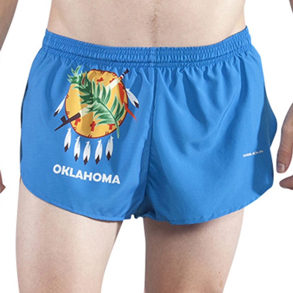 Men's Flag 1" Elite Split Shorts for Oklahoma, featuring a bright blue design with the Oklahoma state flag emblem including a Native American Osage shield, crossed peace pipe and olive branch, and feathers, with OKLAHOMA text printed on the front.