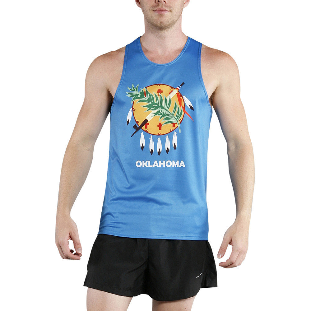 Men's Competitor Lite Printed Singlet in sky blue featuring the Oklahoma state flag design with a Native American Osage warrior shield, crossed peace pipe and olive branch, and white feathers with the word OKLAHOMA printed below.